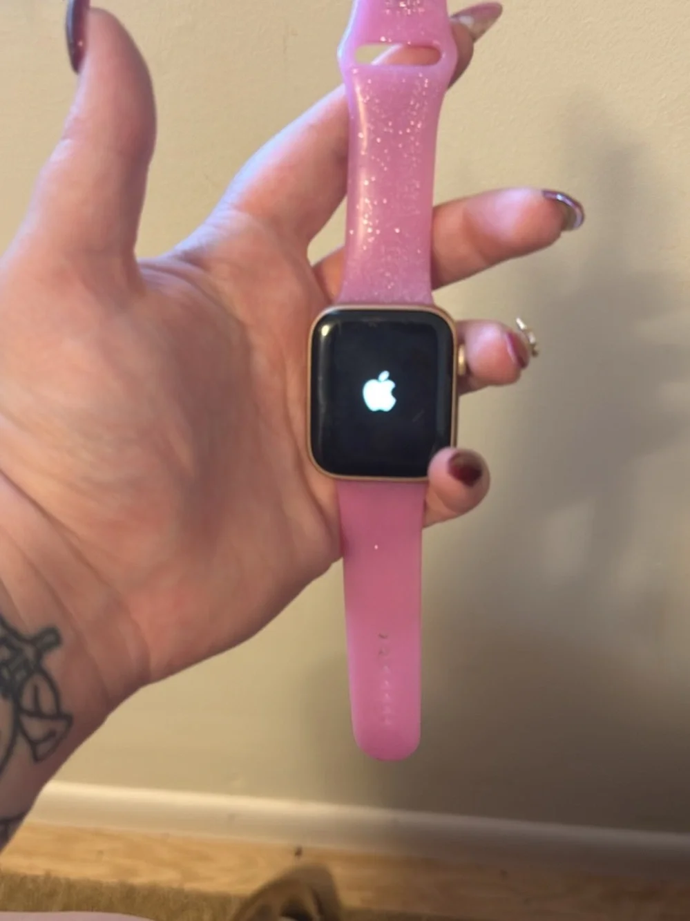 Apple Smartwatch with Pink Silicone Band and Black Display